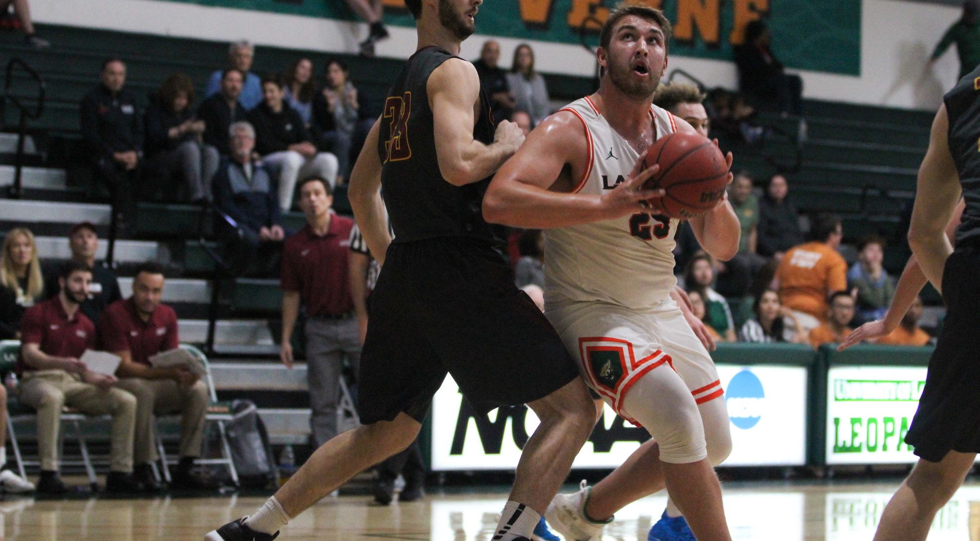 Men's Basketball falls to Linfield on the road